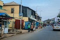 Cityscape of Local African Cape Coast town with Ghana People and Cars on the street