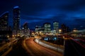 Cityscape of London at night in Canary Wharf, The cityÃ¢â¬â¢s second largest financial center, with light trails on the freeway Royalty Free Stock Photo