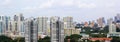 Cityscape of Many modern tall skyscraper condominiums, apartments, with houses in foreground. Buildings, Singapore, city area Royalty Free Stock Photo