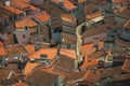 Cityscape with many rooftops and a cobblestone alley Royalty Free Stock Photo