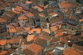 Cityscape with many rooftops and a cobblestone alley Royalty Free Stock Photo