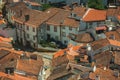 Cityscape with many rooftops and a cobblestone alley Royalty Free Stock Photo