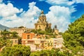 Cityscape of Messina with Cathedral on the top of the hill, colored houses and beautiful clouds with a blue sky, Sicily, Italy Royalty Free Stock Photo