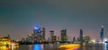 Cityscape of modern building near the river in the night. Modern architecture office building. Skyscraper with evening sky. Royalty Free Stock Photo