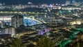 Cityscape of Monte Carlo, Monaco night timelapse with roofs of buildings and traffic on roads. Royalty Free Stock Photo