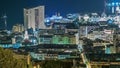 Cityscape of Monte Carlo, Monaco night timelapse with roofs of buildings and traffic on roads. Royalty Free Stock Photo