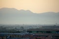 Cityscape with mountains, foggy sky Royalty Free Stock Photo