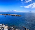 Cityscape of Naples from the waterfront: view of the Gulf of Naples with Vesuvius in the background. Royalty Free Stock Photo