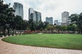 Cityscape near Petronas twin towers park`s pool in Kuala Lumpur, Malaysia Royalty Free Stock Photo