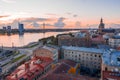 Cityscape near the river with magical stormy sunset over an old town in Riga, Latvia