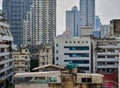 Cityscape and new office buildings near Silom on the background of the old slums of Bangkok