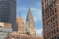 Cityscape of New York city with view of Chrysler building top.