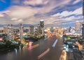 Cityscape night aerial view from rooftop bar over Bangkok`s Chao Phraya river CBD and hotel business district after sunset Royalty Free Stock Photo