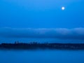 Cityscape in the night with full moon over in the sky Royalty Free Stock Photo