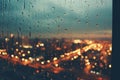 a view of a city at night through a window with rain drops on it Royalty Free Stock Photo
