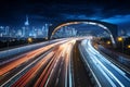 Cityscape and night traffic converge, creating a dynamic urban nocturne