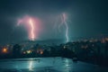 Cityscape at night with two lightning strikes creating dramatic scenery Royalty Free Stock Photo