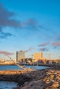 Cityscape over Reykjavik business and touristic downtown, embankment, ocean, harbor, modern buildings and monument of Viking boat