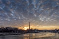 CItyscape of Paris in winter. Ships and brigde over Seine river with Eiffel tower in background and dramatic cloudy sky