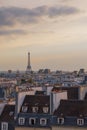 Cityscape of Parisian rooftops and Eiffel Tower. Famous landmark, cultural icon, tourist destination in Paris, France. Royalty Free Stock Photo