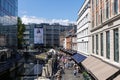 Cityscape with passing people and buildings. Summer city Aarhus, Denmark