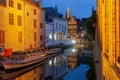 Cityscape with the picturesque night canal Dijver in Bruges