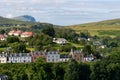 The cityscape of Portree town, Isle of Skye, Scotland at early sunset with typical British houses Royalty Free Stock Photo