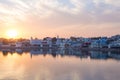 Cityscape at Pushkar, Rajasthan, India. Temples, buildings and ghats reflecting on the holy water of the lake at sunset. Royalty Free Stock Photo