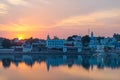 Cityscape at Pushkar, Rajasthan, India. Temples, buildings and ghats reflecting on the holy water of the lake at sunset. Royalty Free Stock Photo