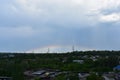 Cityscape with rainbow over the high voltage towers Royalty Free Stock Photo