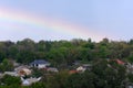 Cityscape with rainbow over the high voltage towers Royalty Free Stock Photo