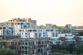 Cityscape residential building tops on light white sky background