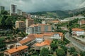 Cityscape with road and building amid trees