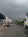 Cityscape Road view with black rain clouds before rain is coming over urban building Royalty Free Stock Photo