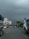 Cityscape Road view with black rain clouds before rain is coming over urban building Royalty Free Stock Photo