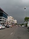 Cityscape Road view with black rain clouds before rain is coming over urban building Royalty Free Stock Photo