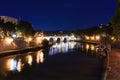 Cityscape romantic night view of Roma. Panorama with Saint Angelo castle and bridge. Famous tourist destination with Tiber. Travel