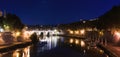 Cityscape romantic night view of Roma. Panorama with Saint Angelo castle and bridge. Famous tourist destination with Tiber. Travel