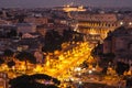 Cityscape of Rome at nitgh with Colosseum Royalty Free Stock Photo