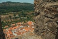 Cityscape with roofs seen by crenel in the castle wall Royalty Free Stock Photo