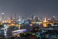 Cityscape rooftop night view of Chao Phraya River, Rattanakosin Island, Wat Arun Buddhist temple, landmark of Bangkok with city