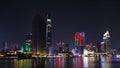 Cityscape of Saigon with colorfully illuminated buildings at night in Vietnam