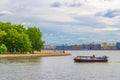 Cityscape of Saint Petersburg Leningrad city with row of old colorful buildings on embankment and boat ship on water of Neva river Royalty Free Stock Photo