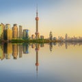 Cityscape of Shanghai and Huangpu River on sunset, beautiful reflection on skyscrapers, China