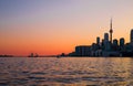 Cityscape - silhouettes of skyscrapers, calm lake old sail ship and yacht. Royalty Free Stock Photo