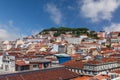 Cityscape and skyline of Lisbon, Portugal. Castelo de Sao Jorge Castle aka Saint or St George Castle, with rooftops of Baixa, Royalty Free Stock Photo