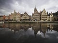 Cityscape skyline puddle reflection of historical Graslei quay at Lys leie river Korenlei Ghent Flanders Flemish Belgium