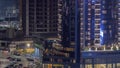 Cityscape of skyscrapers in Dubai Business Bay aerial night timelapse