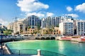 Cityscape with Spinola bay, St. Julians in sunny day, Malta.