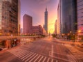 Cityscape of a street corner in Downtown Taipei City with traffic trails in morning twilight Royalty Free Stock Photo